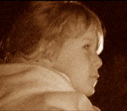 Child watches red dragon